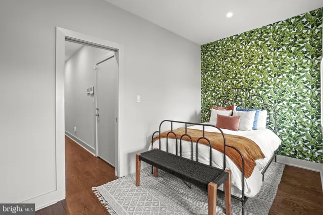 a bedroom with furniture and a window