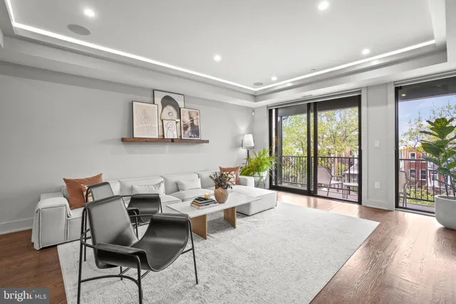 a view of a livingroom with furniture and lounge chair