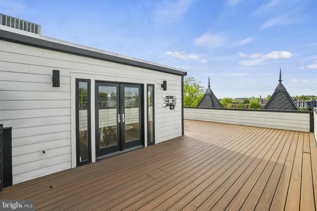 a view of hallway with wooden floor