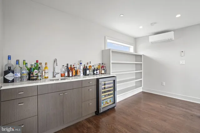 a living room with furniture and a book shelf