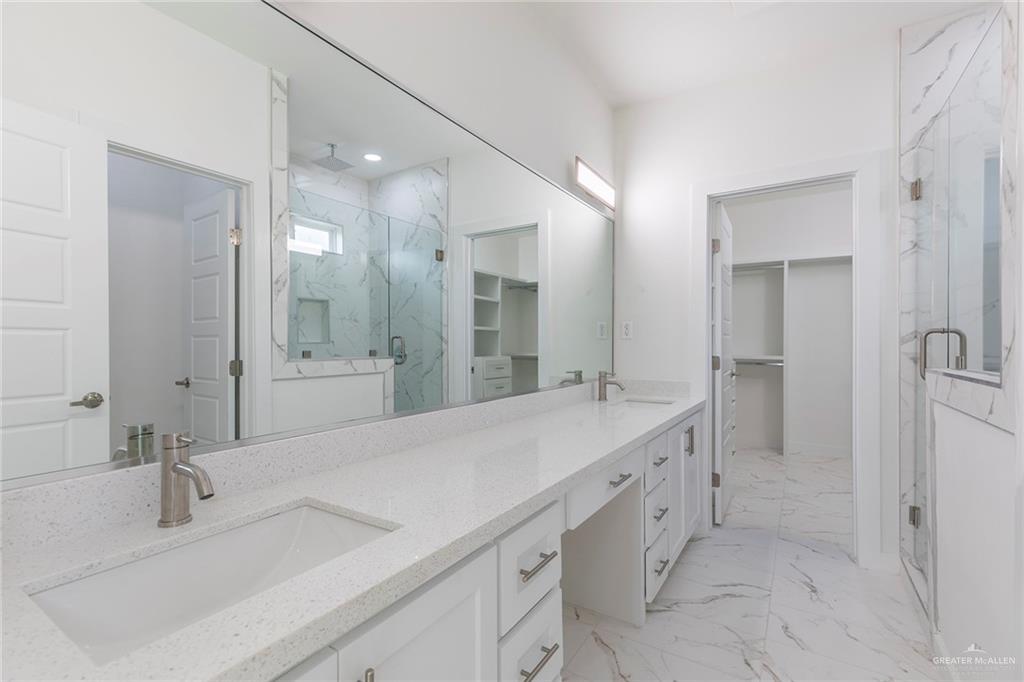 915 Pecan Street Alton, TX 78573 - Photo 11 of 22 a spacious bathroom with a double vanity sink mirror and double