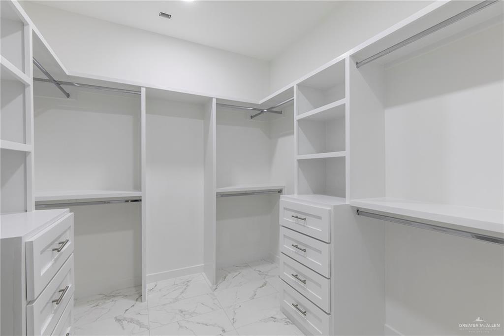 915 Pecan Street Alton, TX 78573 - Photo 12 of 22 a view of an empty walk in closet