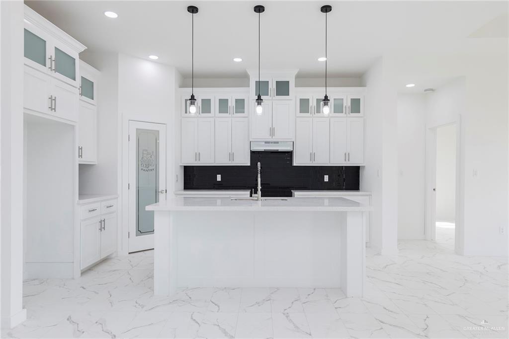 915 Pecan Street Alton, TX 78573 - Photo 5 of 22 a view of kitchen with stainless steel appliances cabinets