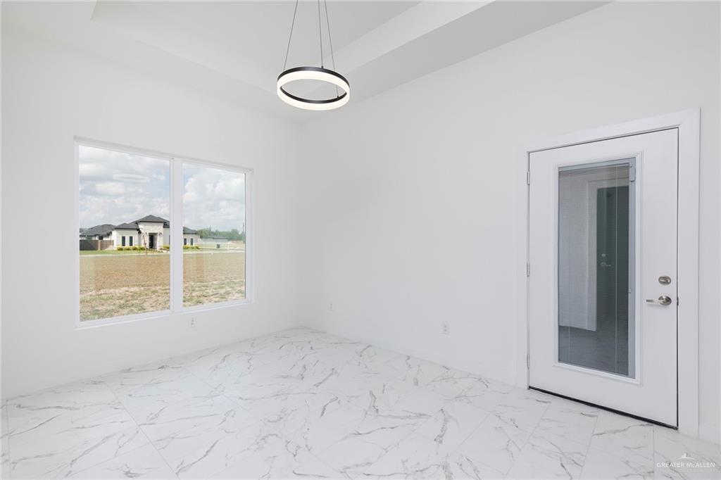 915 Pecan Street Alton, TX 78573 - Photo 9 of 22 an empty room with windows