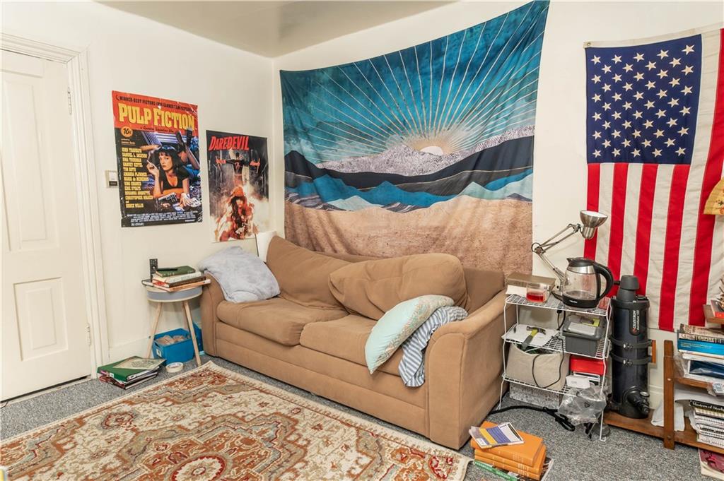 1071-1075 Philadelphia Street Indiana, PA 15701 - Photo 11 of 21 a living room with couch and a painting on the wall