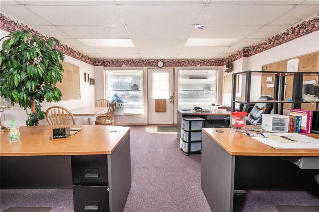 1071-1075 Philadelphia Street Indiana, PA 15701 - Photo 15 of 21 a kitchen with a table chairs stove and cabinets