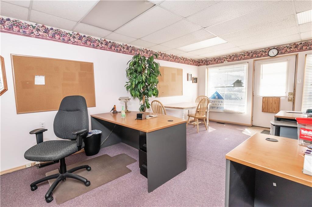 1071-1075 Philadelphia Street Indiana, PA 15701 - Photo 17 of 21 a view of a workspace with furniture and a potted plant
