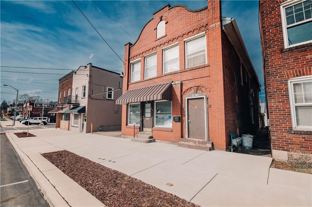 1071-1075 Philadelphia Street Indiana, PA 15701 - Photo 2 of 21 a view of a building with many windows