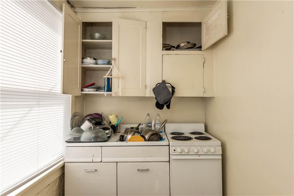 1071-1075 Philadelphia Street Indiana, PA 15701 - Photo 4 of 21 a kitchen with a stove and cabinets
