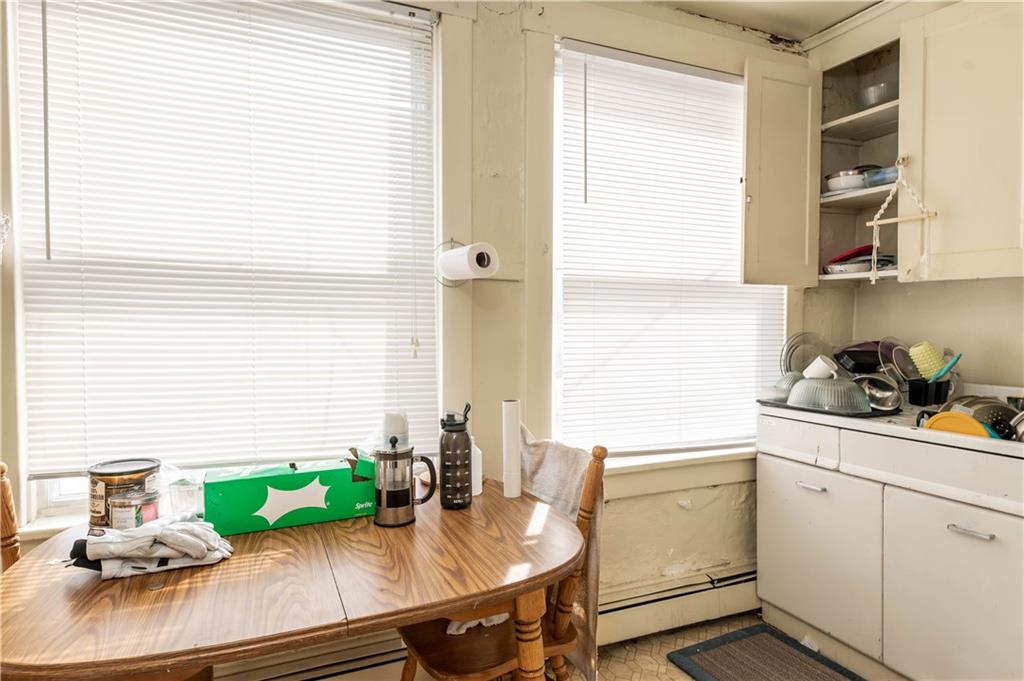 1071-1075 Philadelphia Street Indiana, PA 15701 - Photo 6 of 21 a kitchen with a sink cabinets and window