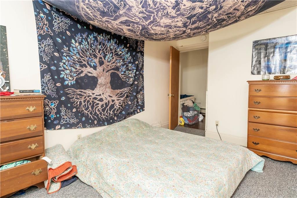 1071-1075 Philadelphia Street Indiana, PA 15701 - Photo 7 of 21 a bedroom with a bed and a dresser