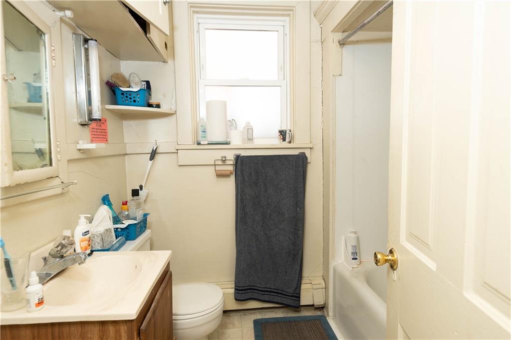 1071-1075 Philadelphia Street Indiana, PA 15701 - Photo 8 of 21 a bathroom with a sink a toilet and tub