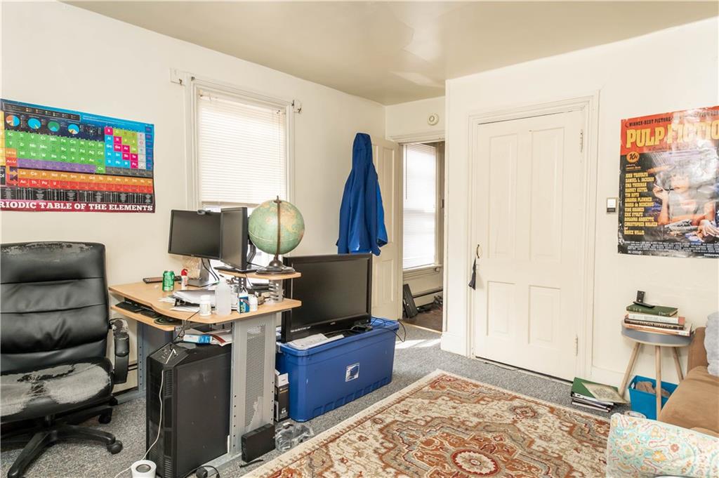 1071-1075 Philadelphia Street Indiana, PA 15701 - Photo 10 of 21 a living room with furniture a rug and a flat screen tv