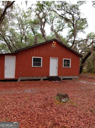 a house with trees in the background