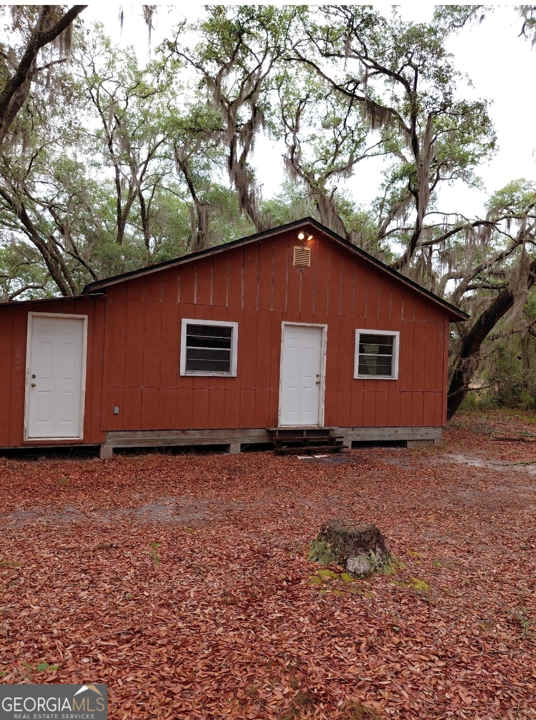 779 Ralph Davis Road, Unit 1 LAND LOT Folkston, GA 31537 - Photo 20 of 28 a house with trees in the background