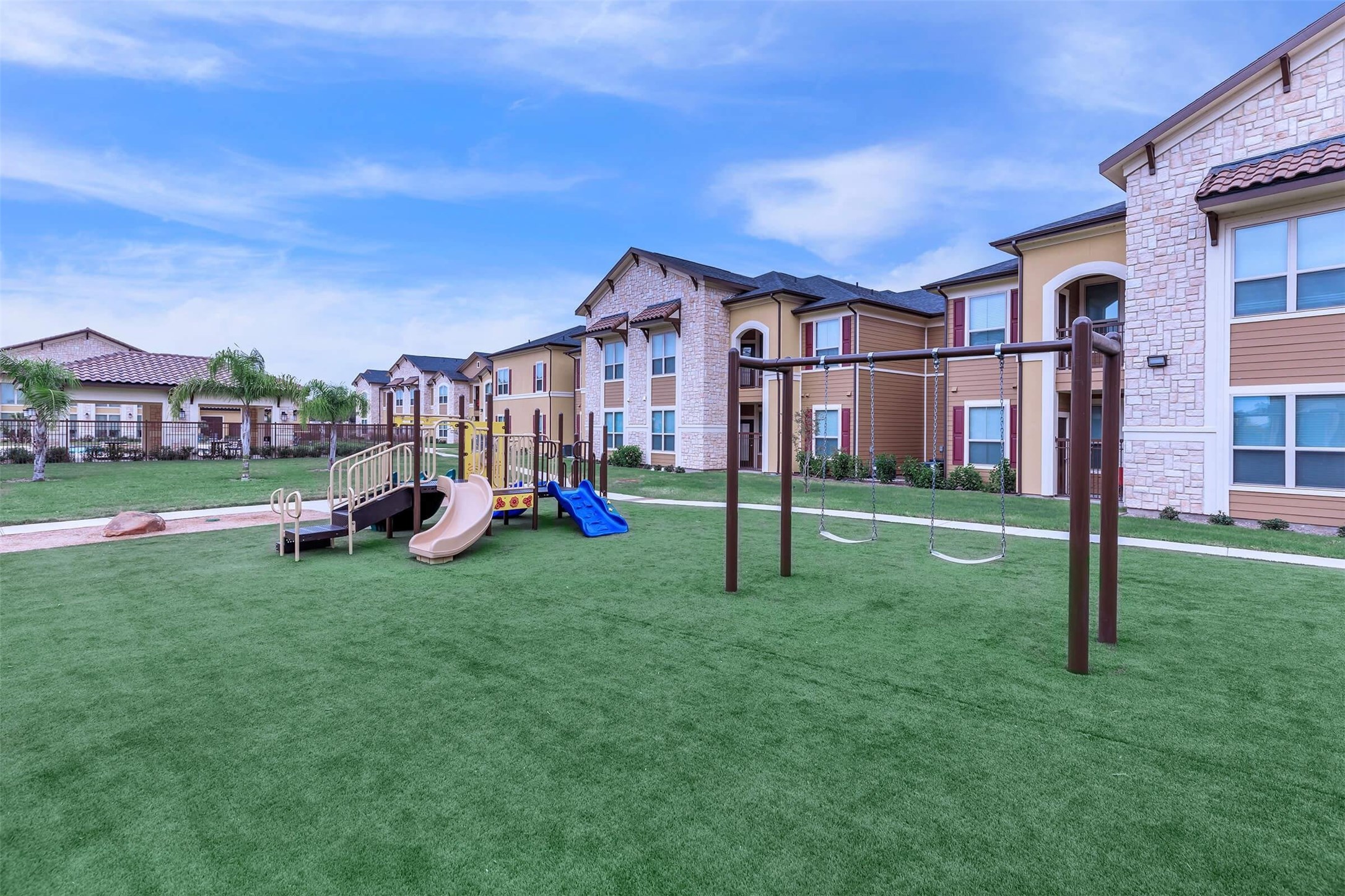 2601 South Border Avenue, Unit 132 Weslaco, TX 78596 - Photo 3 of 6 a view of a house with a big yard and large trees
