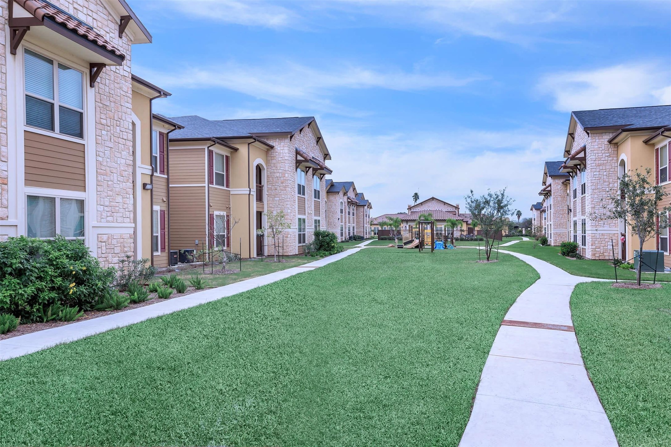 2601 South Border Avenue, Unit 132 Weslaco, TX 78596 - Photo 4 of 6 a front view of a house with a yard