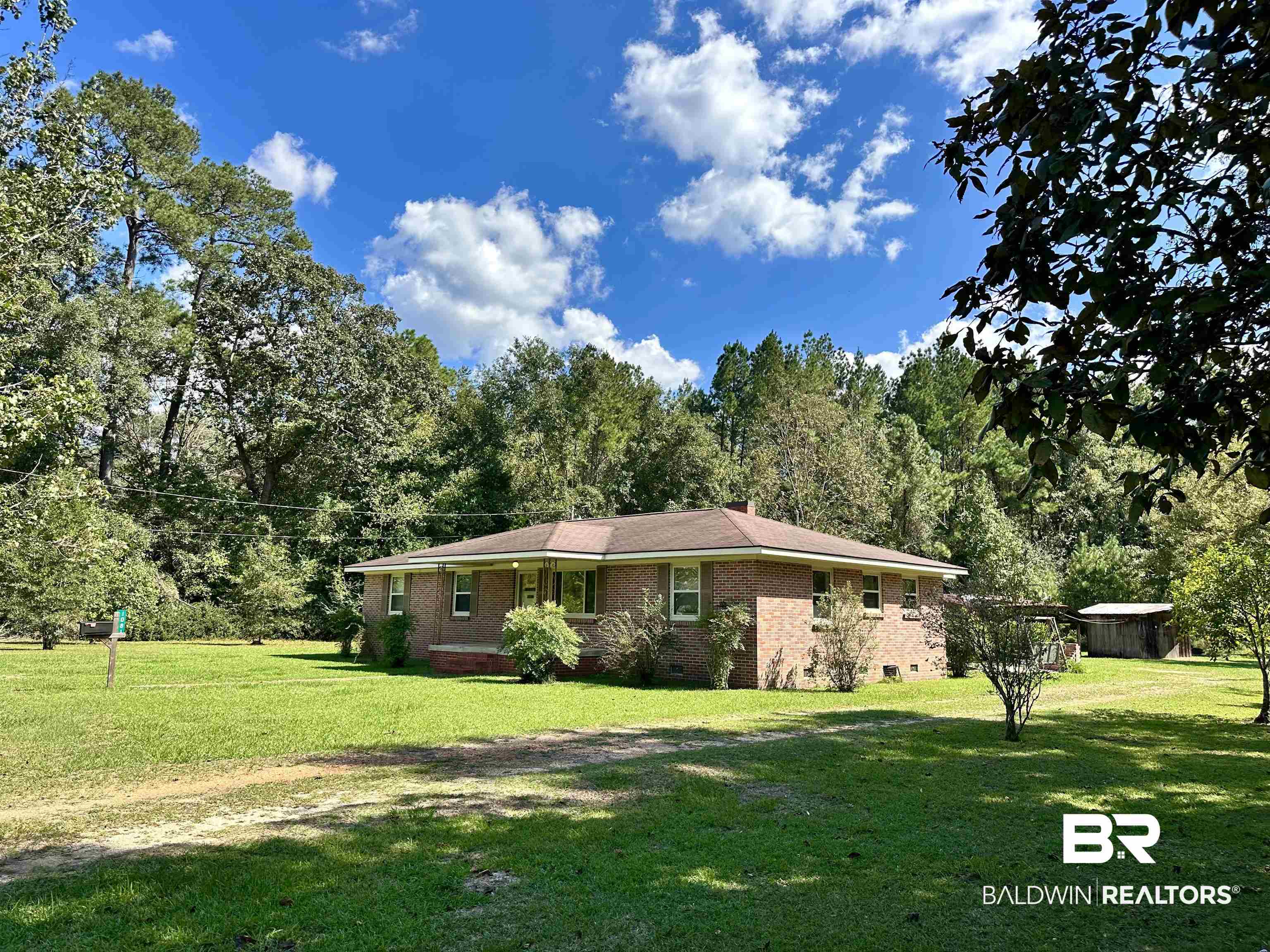 1081 Jay Road Brewton, AL 36426 - Photo 2 of 19 View of home's exterior with a yard