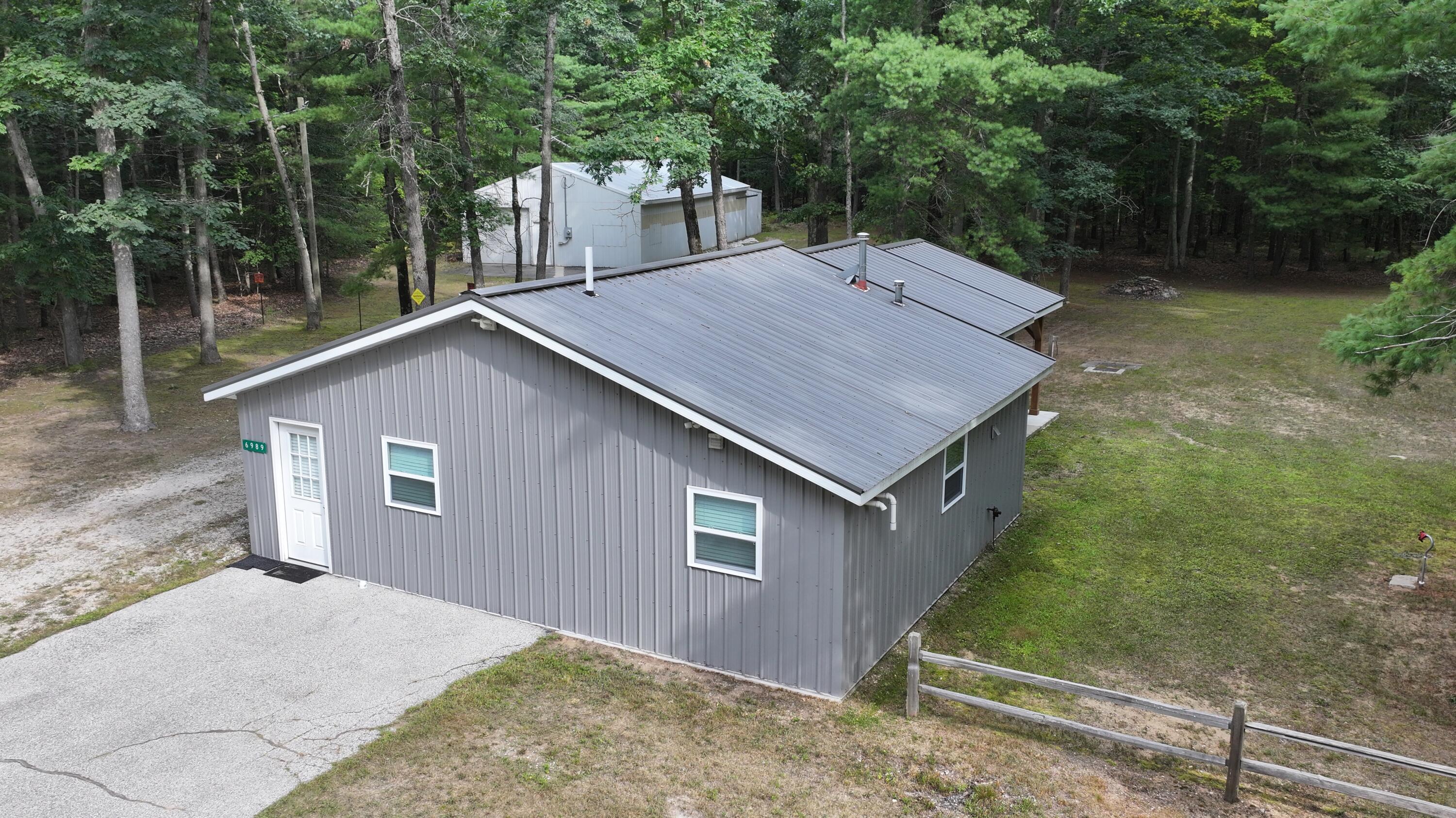 9232 West 7 Mile Road Irons, MI 49644 - Photo 28 of 28 DJI_20260729175637_0496_D