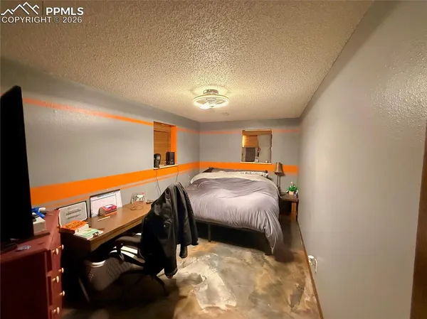 a bed room with a bed and a night stand