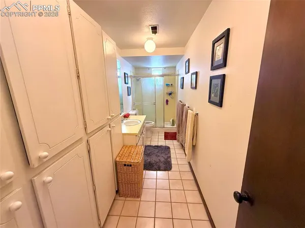 a view of a hallway with furniture and front door