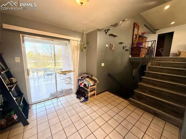 a bedroom with double bunk beds and a window
