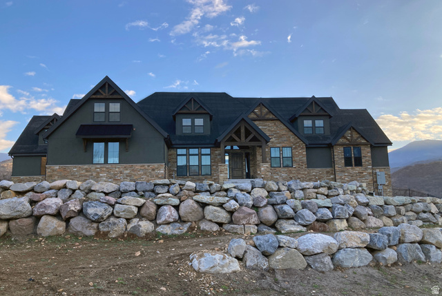 259 Meadow Drive Springville, UT 84663 - Photo 1 of 62 View of front of home featuring stucco siding, stone siding, and a mountain view