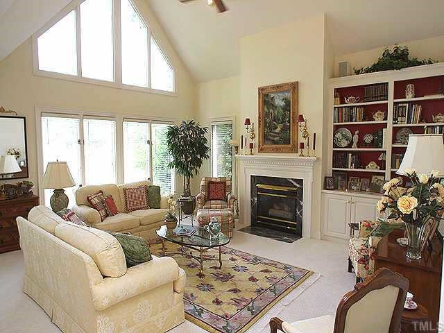 2913 Tillinghast Trail Raleigh, NC 27613 - Photo 2 of 12 Wonderful living room with cathedral ceiling,gas log fireplace and nice built ins. Windows look out to golf course. Other