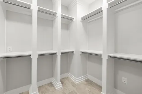 a bathroom with a bathtub and a mirror