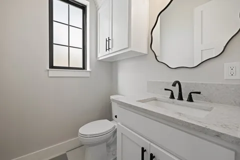 a view of a terrace with a fireplace and a floor to ceiling window