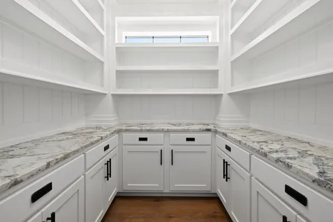 a view of an empty room with a fireplace