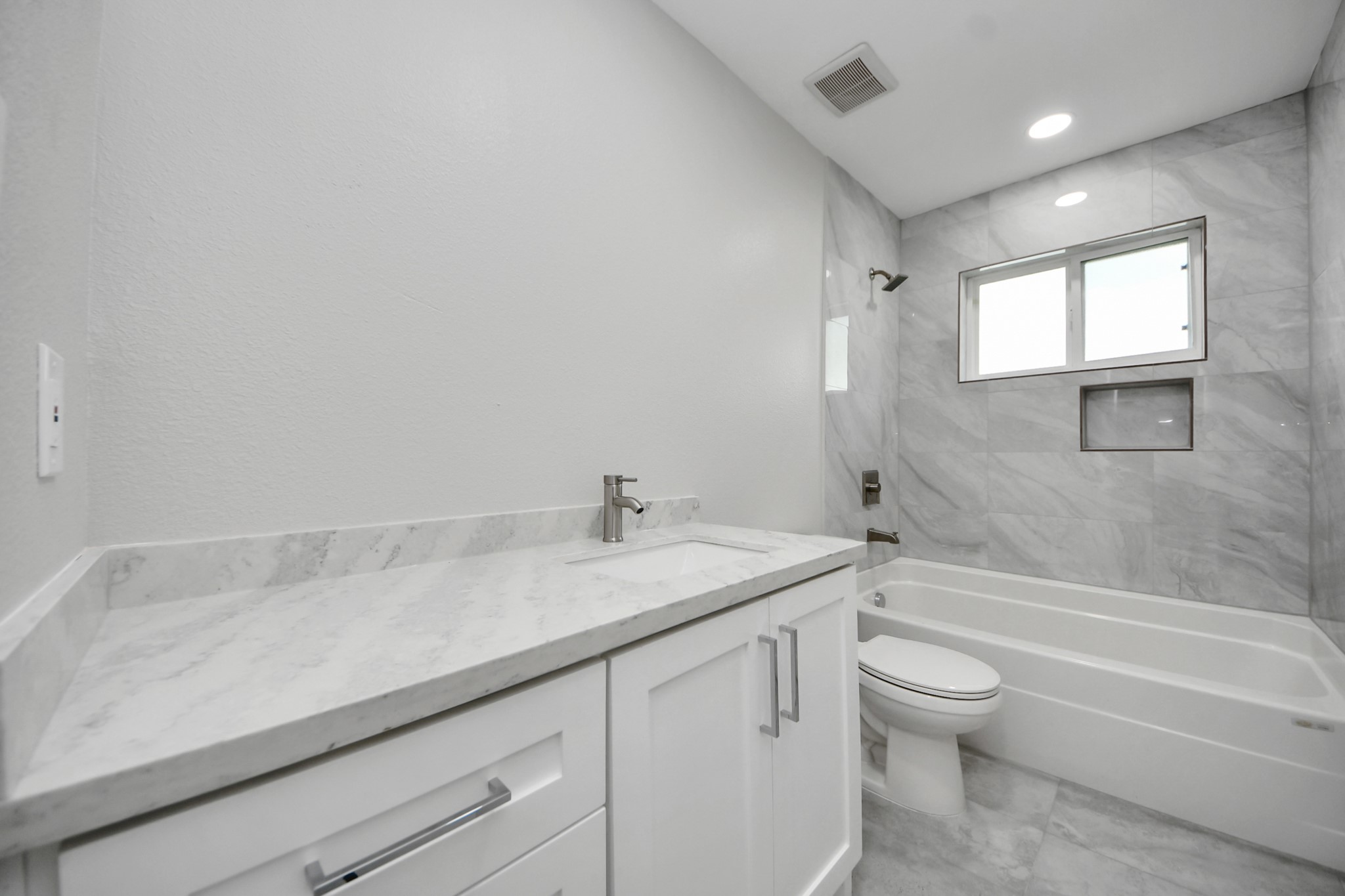 15318 Corsair Road Houston, TX 77053 - Photo 11 of 23 a bathroom with a granite countertop sink a toilet and bathtub