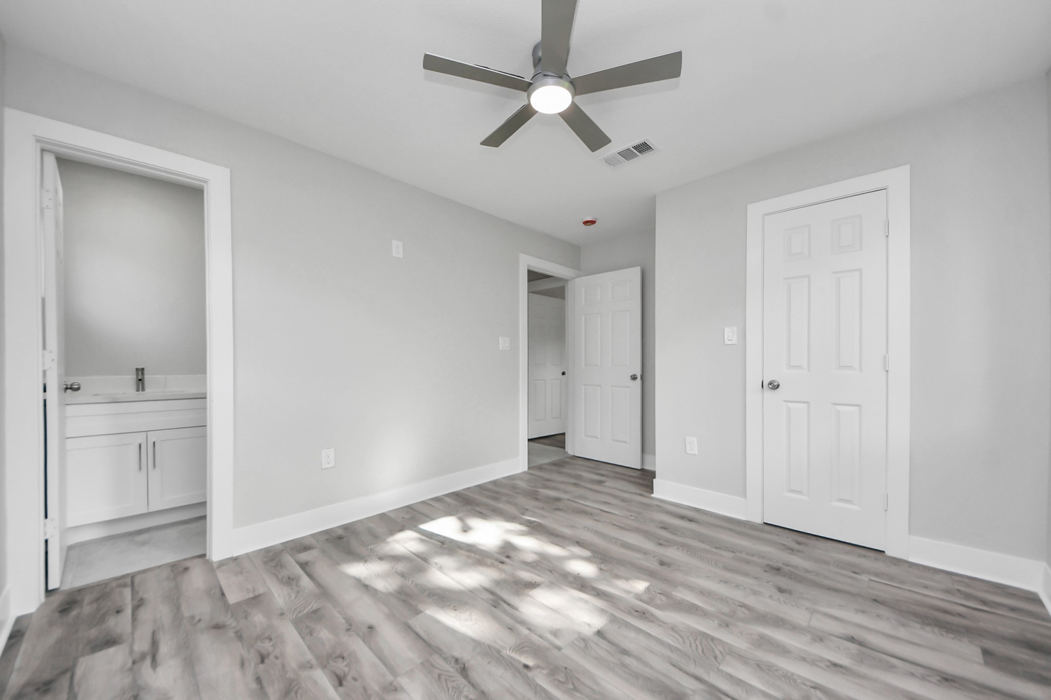 15318 Corsair Road Houston, TX 77053 - Photo 12 of 23 wooden floor in an empty room with a window