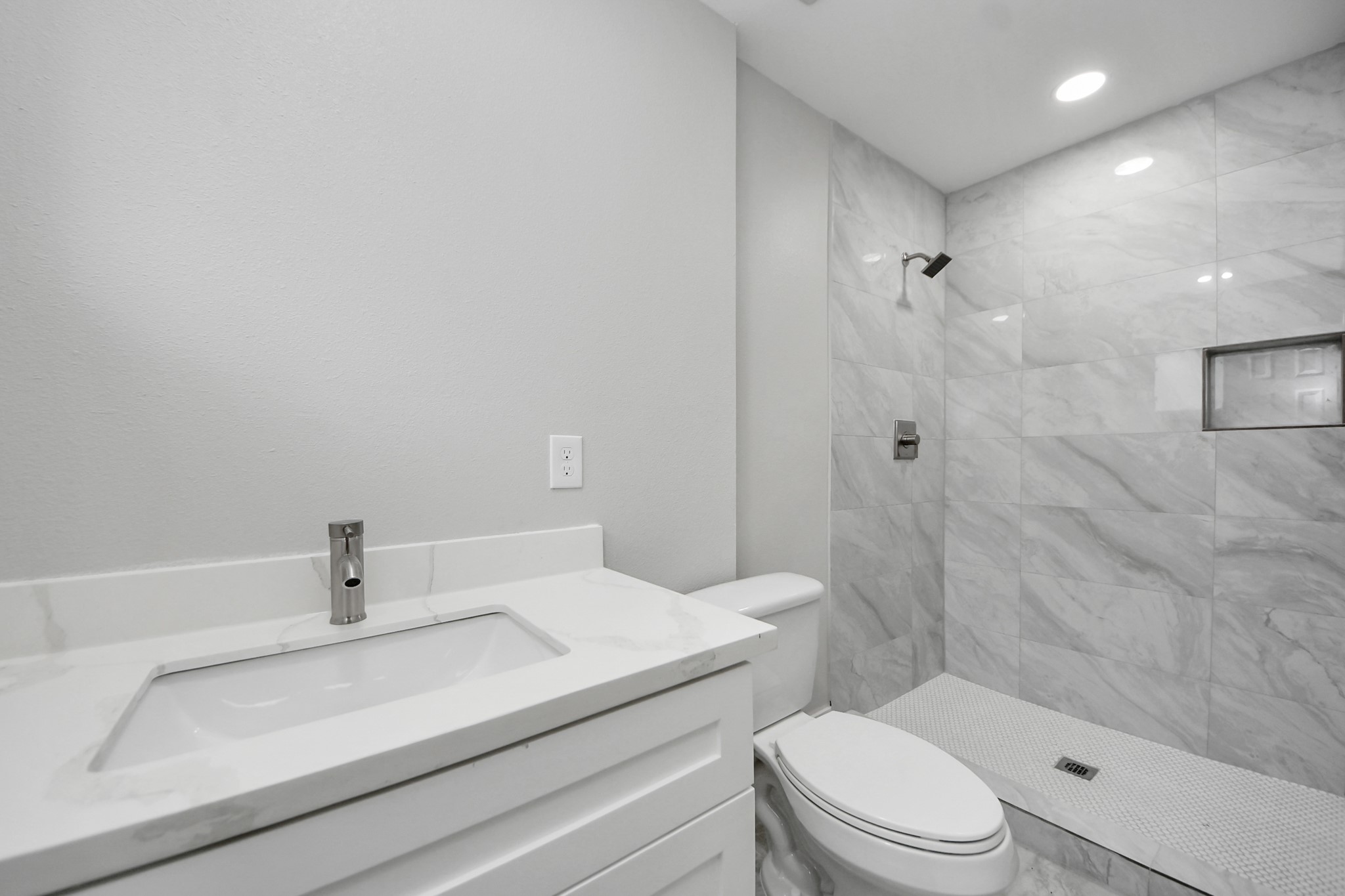 15318 Corsair Road Houston, TX 77053 - Photo 14 of 23 a bathroom with a sink a toilet and shower