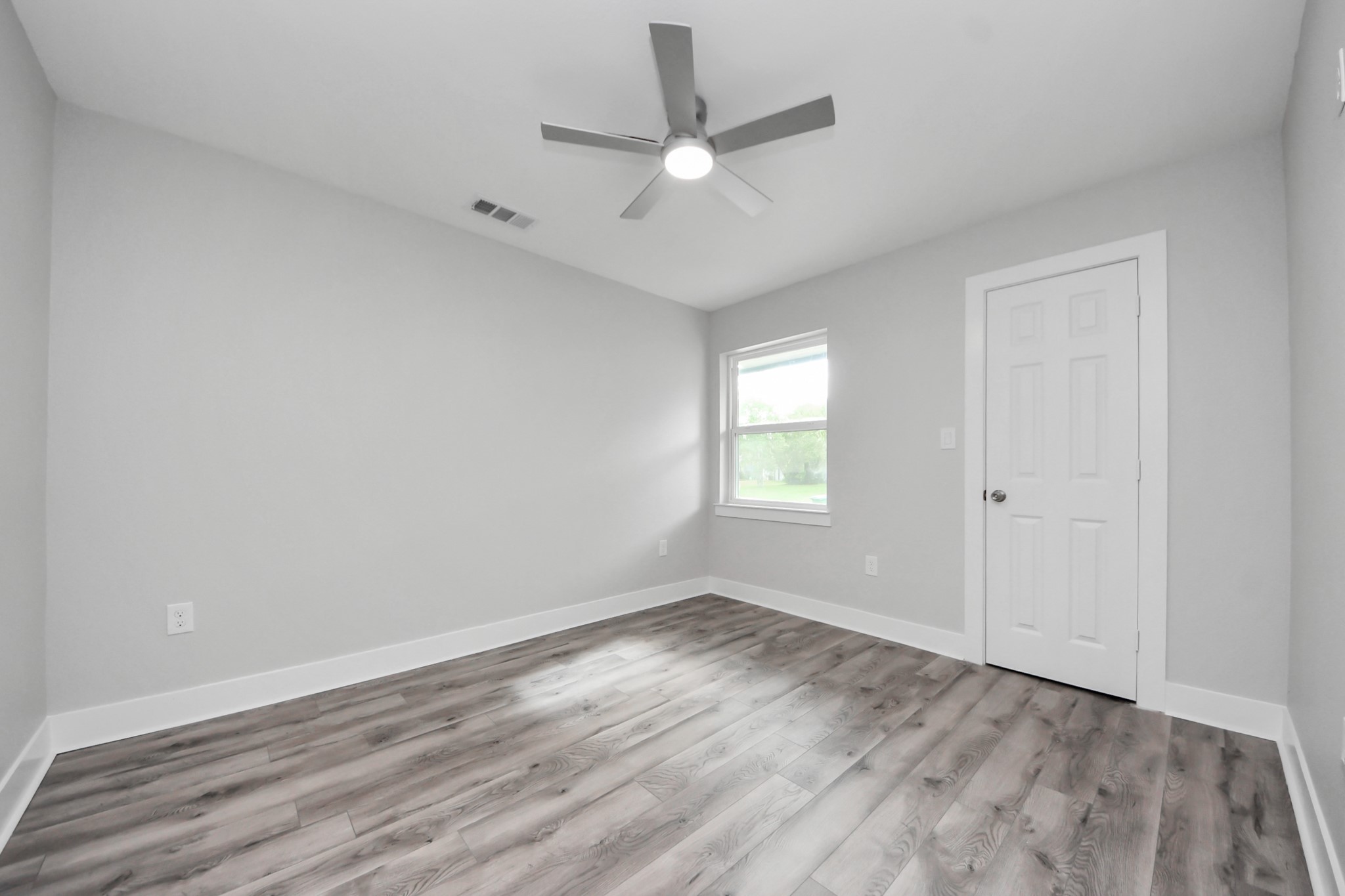 15318 Corsair Road Houston, TX 77053 - Photo 15 of 23 wooden floor in an empty room with a window