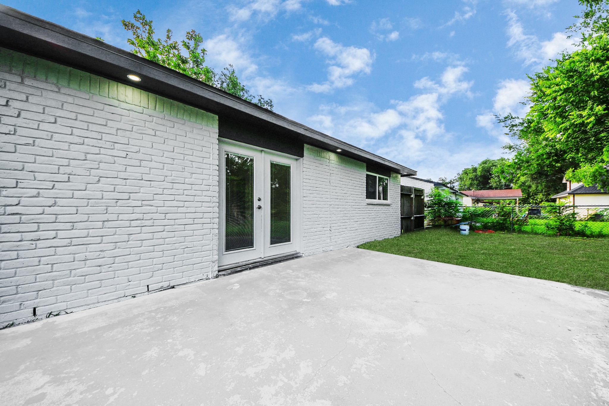 15318 Corsair Road Houston, TX 77053 - Photo 17 of 23 a backyard of a house with plants and tree