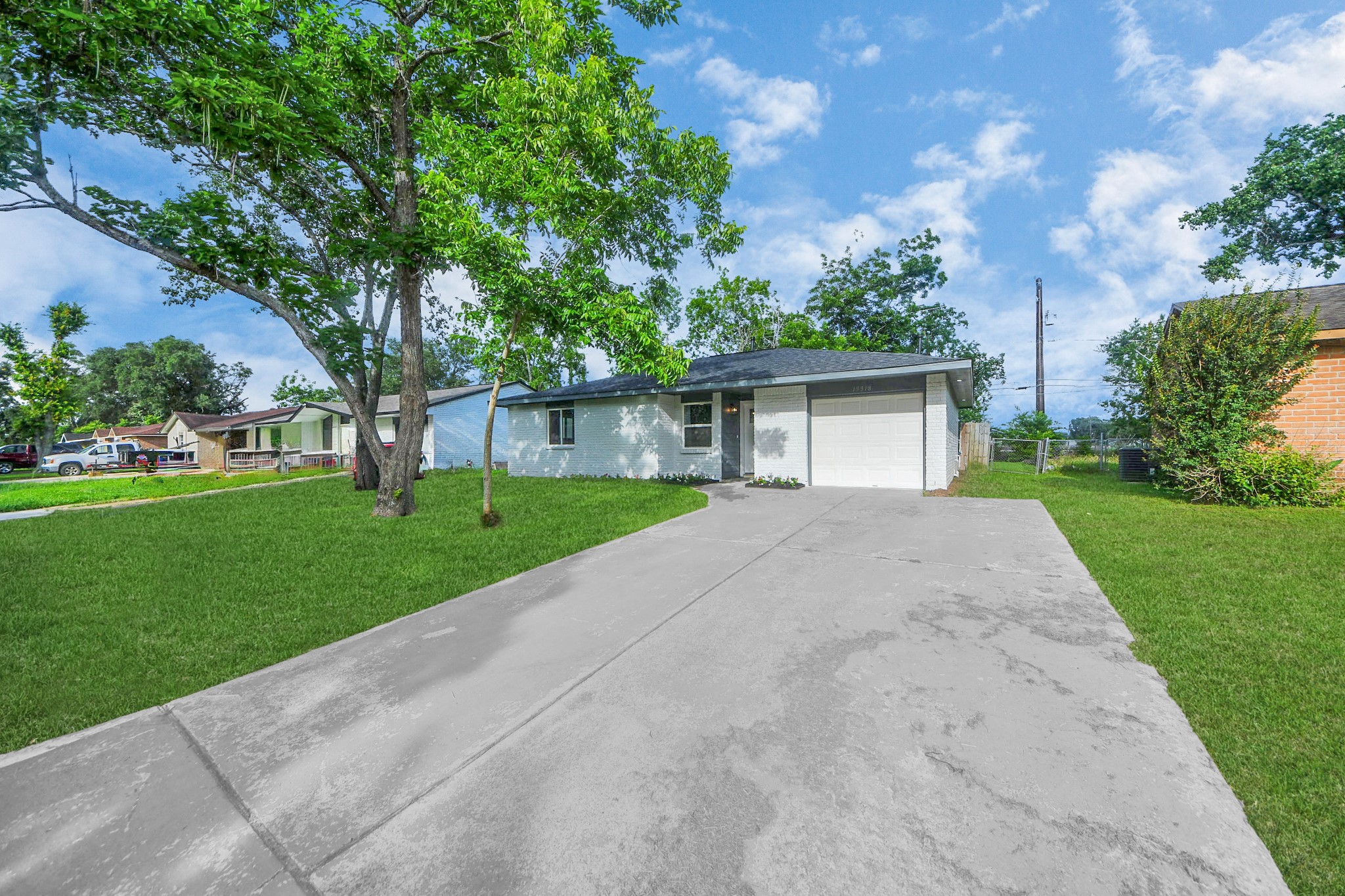 15318 Corsair Road Houston, TX 77053 - Photo 20 of 23 a front view of a house with a yard