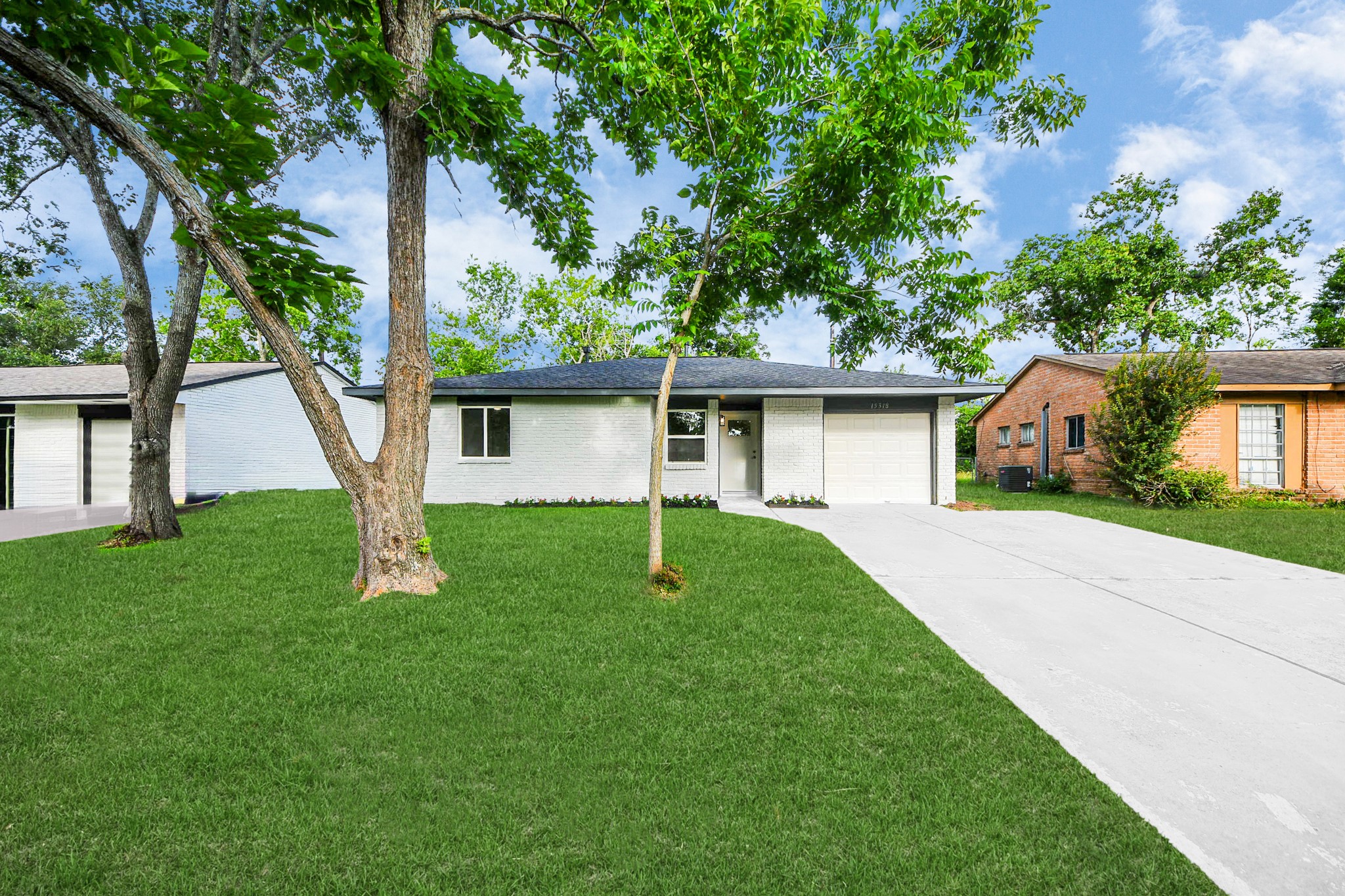 15318 Corsair Road Houston, TX 77053 - Photo 2 of 23 front view of a house with a yard