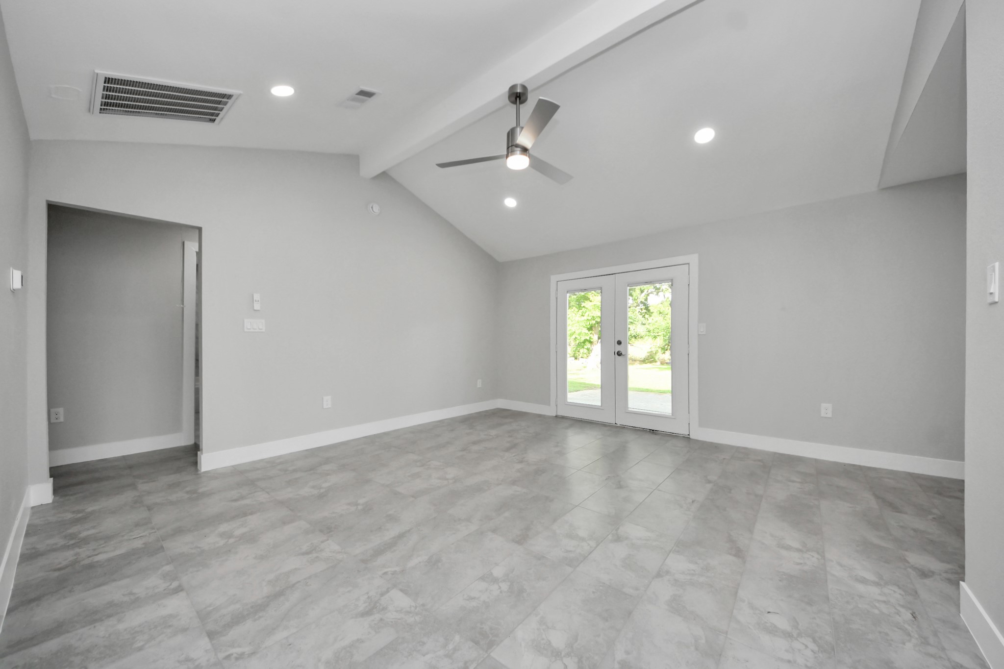 15318 Corsair Road Houston, TX 77053 - Photo 4 of 23 an empty room with chandelier fan and windows