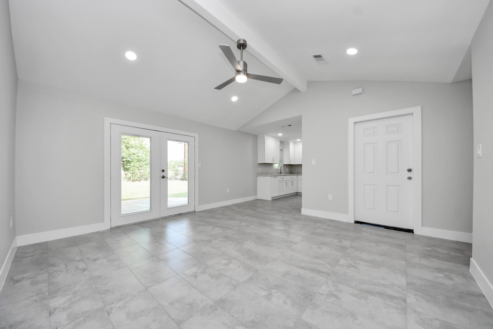 15318 Corsair Road Houston, TX 77053 - Photo 5 of 23 an empty room with chandelier fan and windows