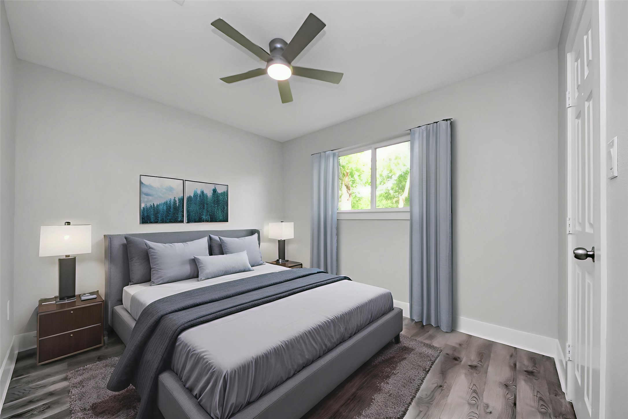 15318 Corsair Road Houston, TX 77053 - Photo 9 of 23 a bedroom with a large bed and a chandelier