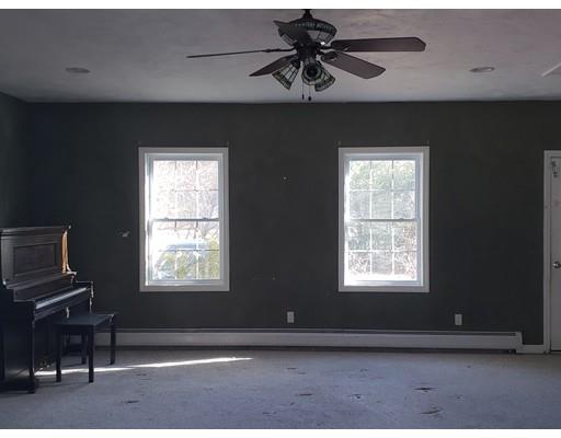 100 Haggerty Road Charlton, MA 01507 - Photo 8 of 22 a view of room with a window and a ceiling fan