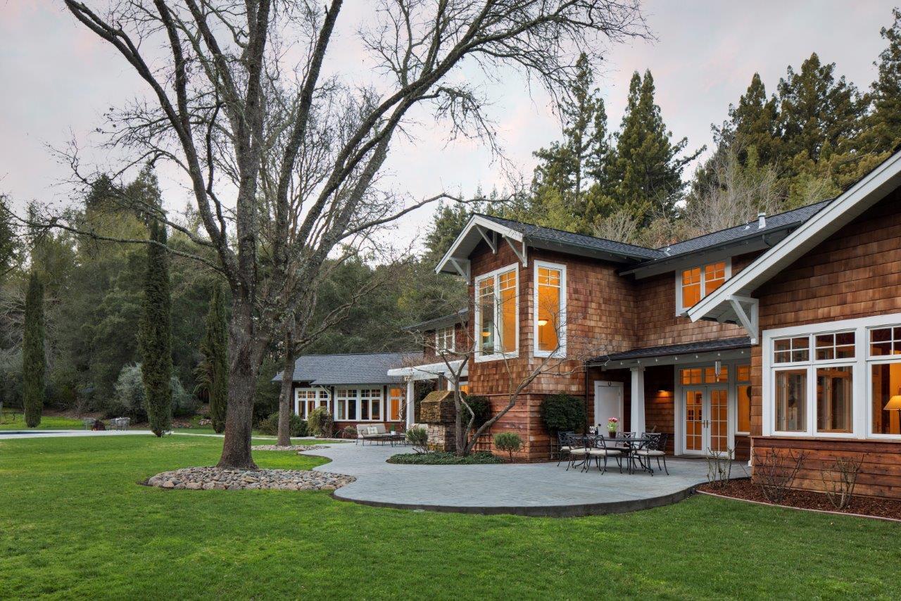 100 Phillip Road Woodside, CA 94062 - Photo 17 of 19 a front view of a house with a yard table and chairs