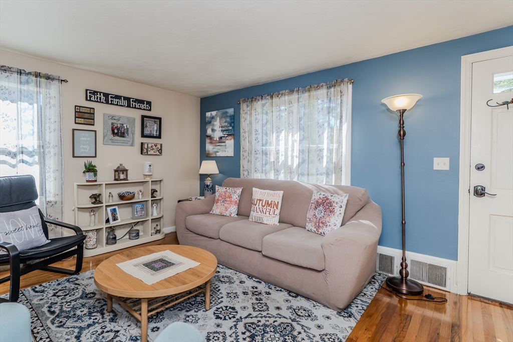 57 Lumae Street Springfield, MA 01119 - Photo 12 of 36 a living room with furniture and a rug