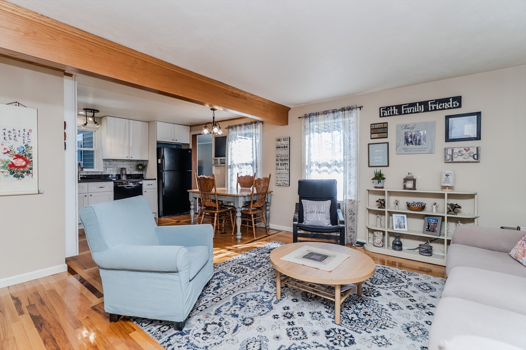 57 Lumae Street Springfield, MA 01119 - Photo 14 of 36 a living room with furniture and a wooden floor