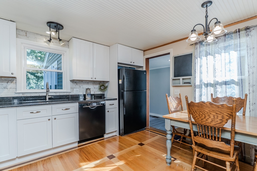 57 Lumae Street Springfield, MA 01119 - Photo 19 of 36 a kitchen with stainless steel appliances granite countertop a refrigerator and a stove top oven