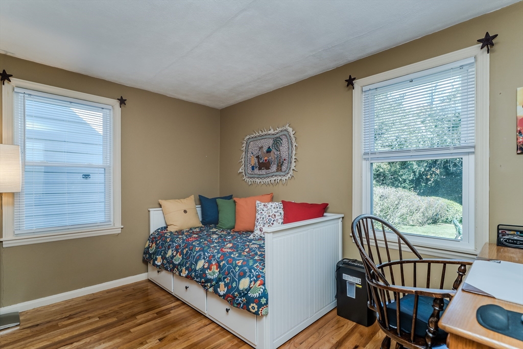 57 Lumae Street Springfield, MA 01119 - Photo 23 of 36 a view of a bedroom with wooden floor and windows