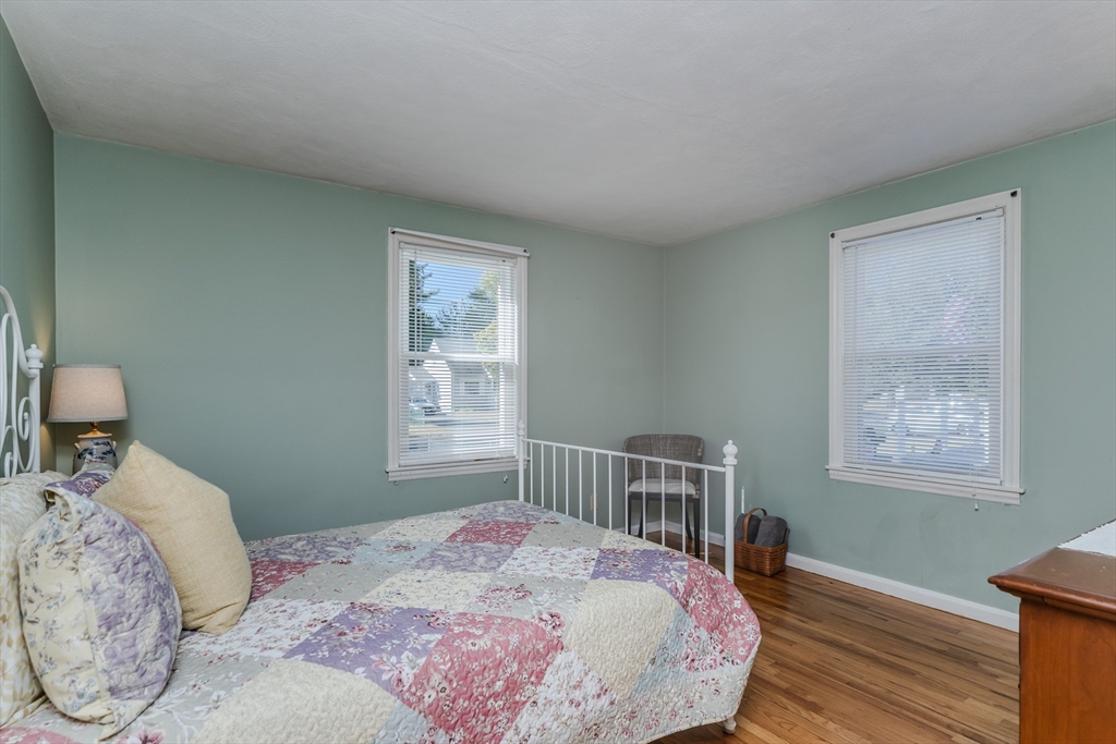 57 Lumae Street Springfield, MA 01119 - Photo 25 of 36 a bedroom with a bed wooden floor and a window