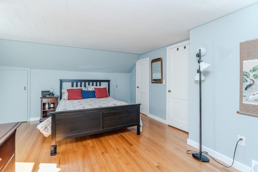 57 Lumae Street Springfield, MA 01119 - Photo 28 of 36 a bedroom with a bed and a dresser in it