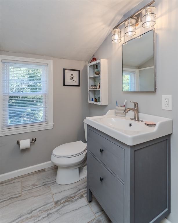 57 Lumae Street Springfield, MA 01119 - Photo 30 of 36 a bathroom with a sink toilet and a mirror